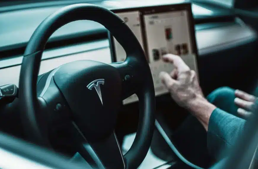 Tesla driver interacting with vehicle touchscreen highlighting software-related issues under California Lemon Law